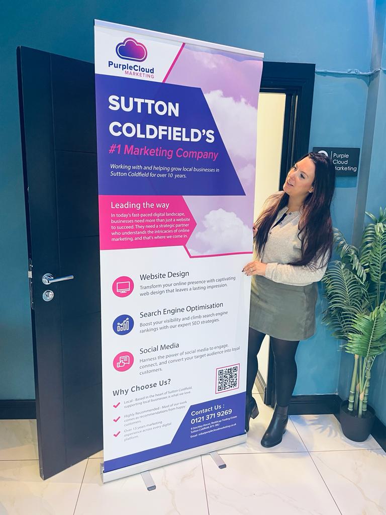 Purple Cloud Solutions team with marketing banner